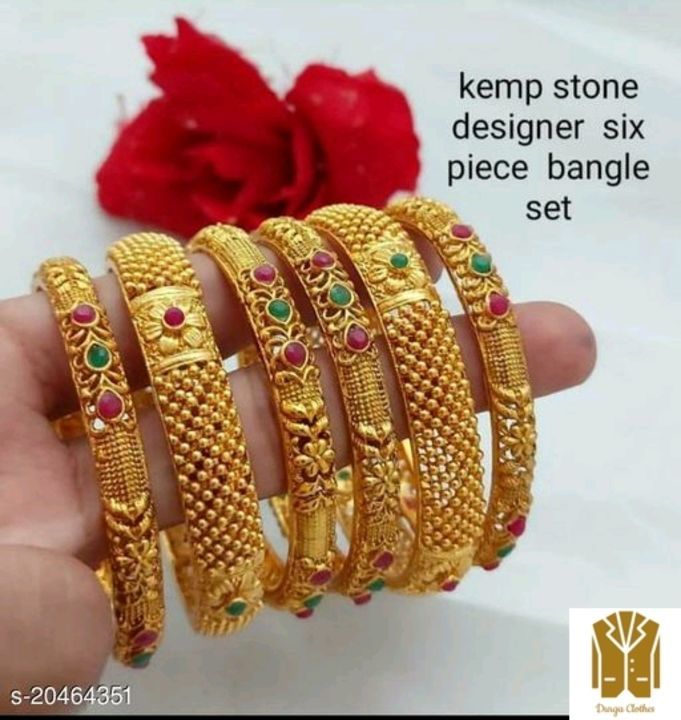 Post image Shimmering Chunky Bracelet &amp; Bangles

Base Metal: Alloy
Plating: Gold Plated
Stone Type: Artificial Stones
Sizing: Non-Adjustable
Type: Chooda
Multipack: 6
Sizes: 2.4, 2.6, 2.8
Dispatch: 2-3 Days