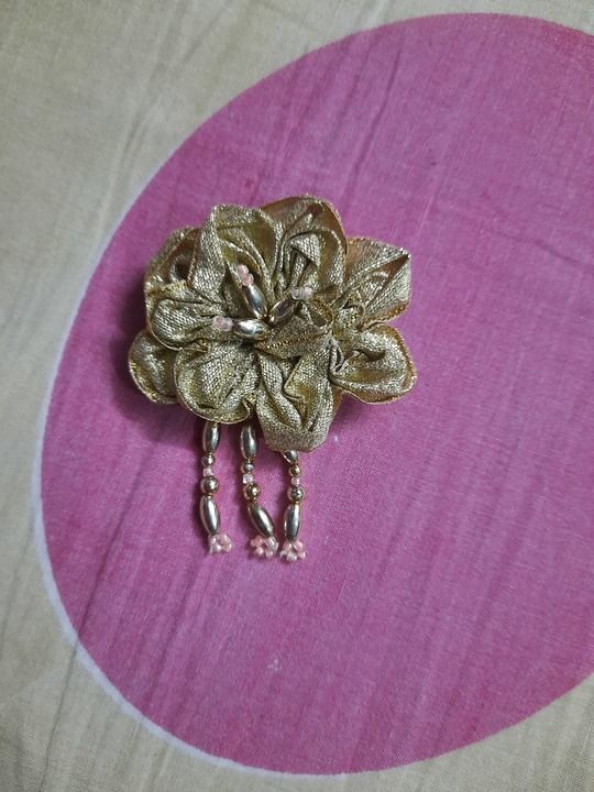 Golden ribbon brooch uploaded by Dharala Products  on 4/11/2021