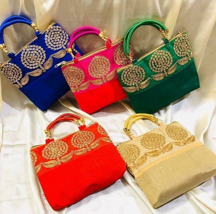 Post image Beautiful Raw silk embroidery hand bags with golden work😍