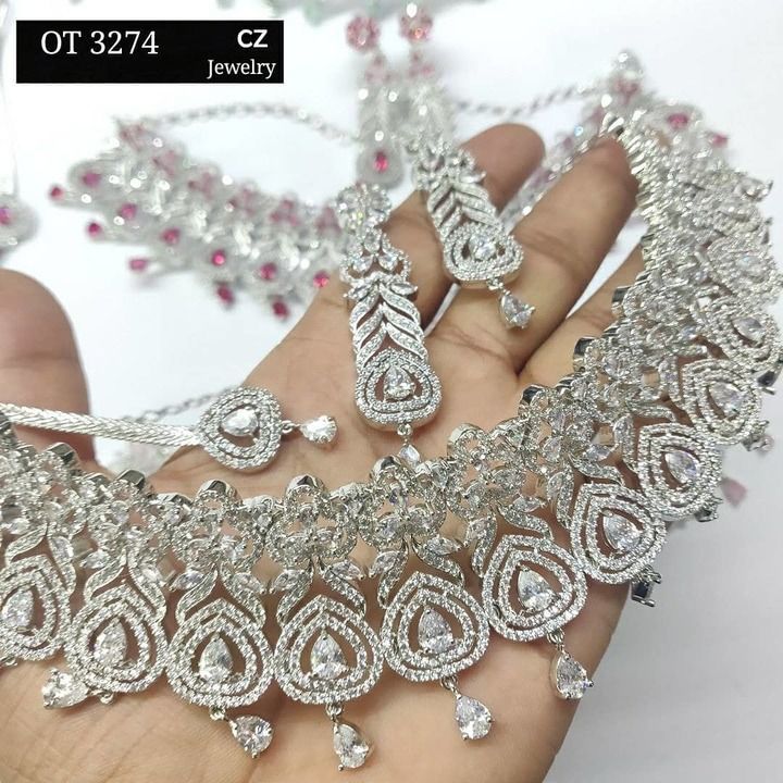 Highly demanded High quality cz white rhodium and rose gold plated designed choker with earrings. uploaded by The Jewel Box on 5/2/2021