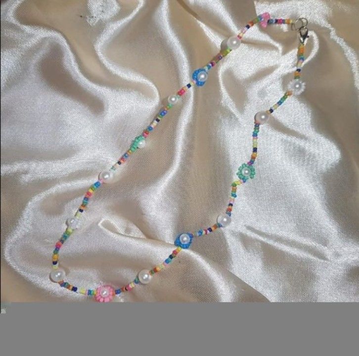 Colorful daisy and pearl necklace  uploaded by The Saturn Shop on 5/9/2021