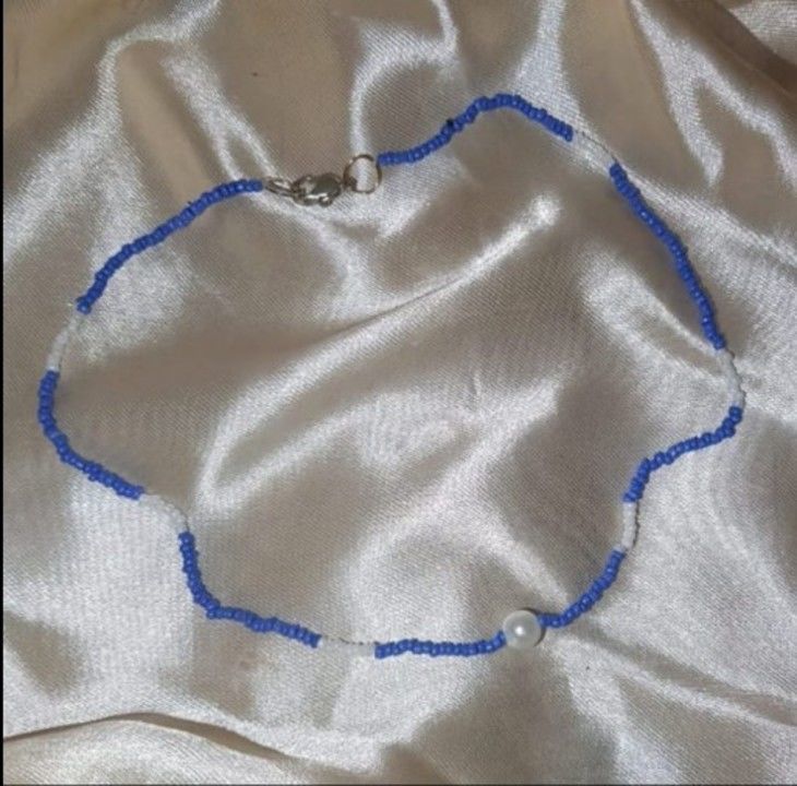 Blue and white choker uploaded by The Saturn Shop on 5/9/2021