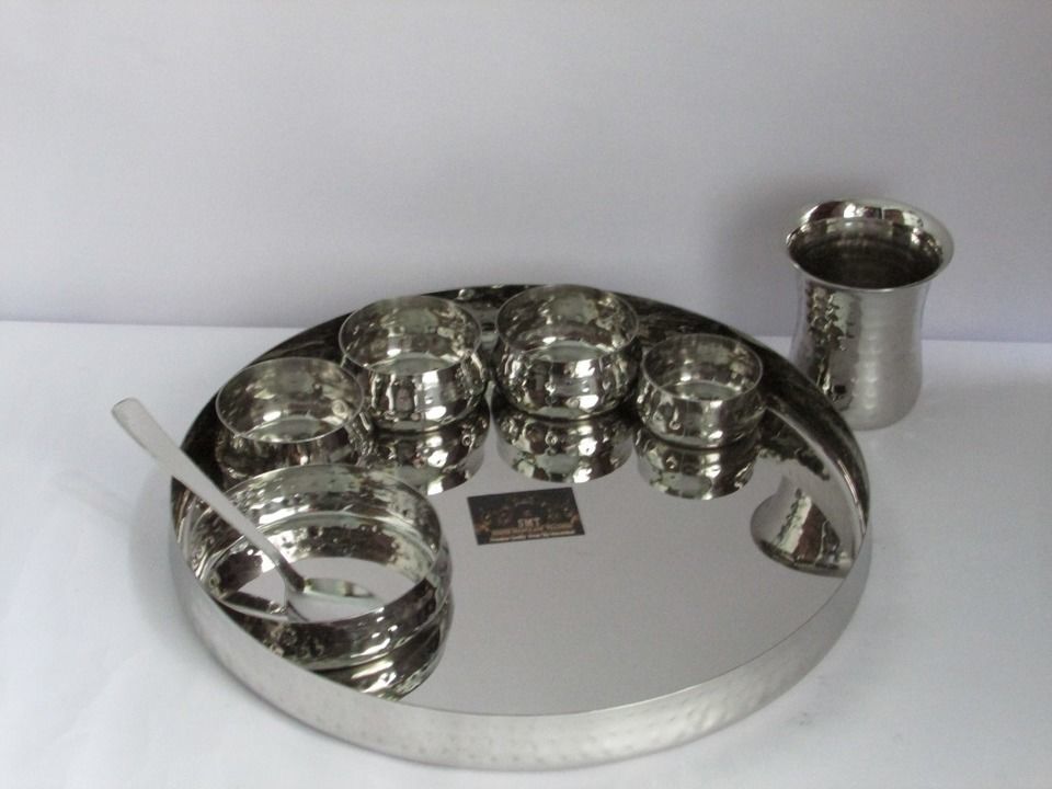 Post image Its a pure steel hameer thali set having 8 piece in set inclurlde 1 plate 1 glass 1 spoon 3 katori 1 chatni katori 1 pudding