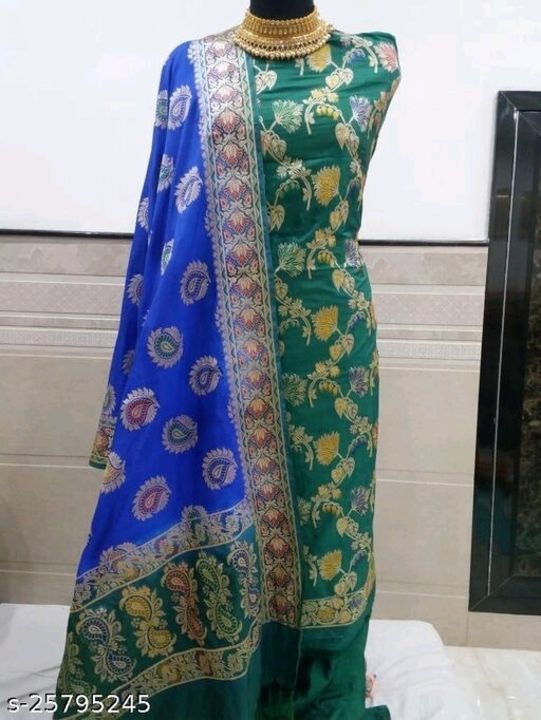 Post image Adrika Graceful Salwar Suits &amp; Dress Materials

Top Fabric: Banarasi Silk + Top Length: 2.5 Meters
Bottom Fabric: Banarasi Silk + Bottom Length: 2.5 Meters
Dupatta Fabric: Banarasi Silk + Dupatta Length: 2.3 Meters
Lining Fabric: Art Silk
Type: Un Stitched
Pattern: Woven Design
Multipack: Single
Price:2300