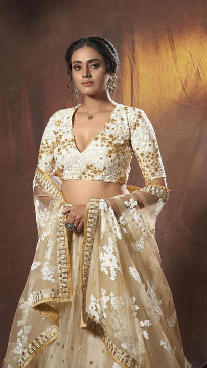 Post image Lehenga Design Details:-  Beige  color Net Sequence Semi-stitched Lehenga Choli 

Rate:-  2749

Size &amp; fit
         Free Size up to 44″

Material &amp; Care
        Lehenga Fabric: Soft Net Huge Flair 

        Choli Fabric: Satin Silk 

        Dupatta Fabric: Soft Net 

Wash Care: Dry-clean

Work Type
         Sequence Embroidery Work

Stitch type  
         Lehenga - Semi Stitched with CanCan\
         Choli - UnStitched 

Inner Butter Crap Silk
Occasion
         You can wear in Parties and  Wedding functions.

How You Look
         Wear this set with heavy jhumkas, jeweled hairpins and embellished sandals to be the cynosure of all eyes.

100% Authentic Product