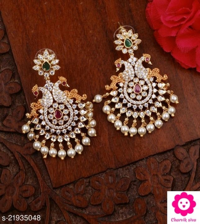 Post image Shimmering Fancy Earrings

Base Metal: Brass &amp; Copper
Plating: Gold Plated
Stone Type: Pearls
Sizing: Non-Adjustable
Type: Chandbalis
Multipack: 1
Dispatch: 2-3 Days