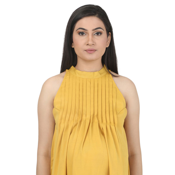 Yellow Tunic with halter neckline and releasef tucks. uploaded by Dress My Babybump on 8/5/2021