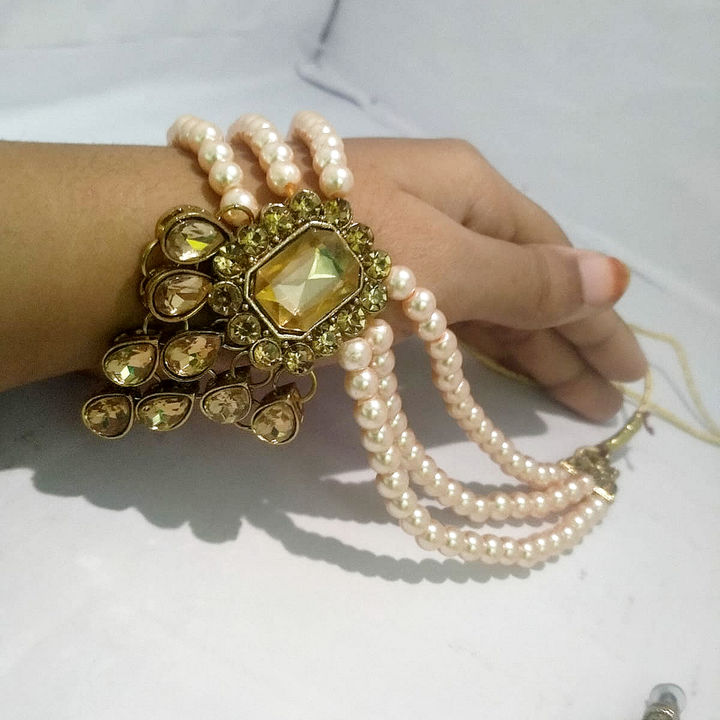 3 layer Rose gold pearls with golden stone work Chokar set. uploaded by Dress up Girls Shop. on 8/10/2021