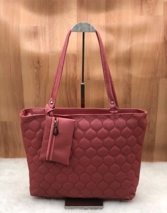Post image Classic Fancy Women HandbagsMaterial: PUNo. of Compartments: 2Pattern: Self DesignMultipack: 1Sizes:Free Size (Length Size: 16 in, Width Size: 3 in, Height Size: 12 in) 
fancy hand bag for women