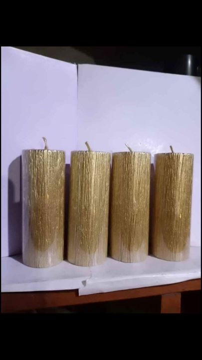Metalic golden pillar candles  uploaded by business on 9/8/2021
