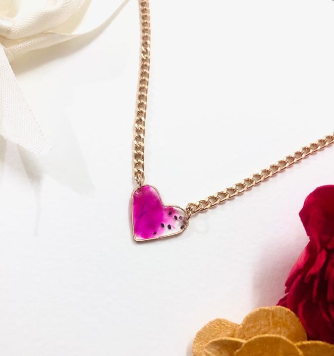 Resin heart with rose gold chain uploaded by business on 9/17/2021