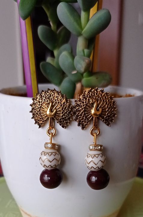 White and brown earrings uploaded by business on 9/20/2021