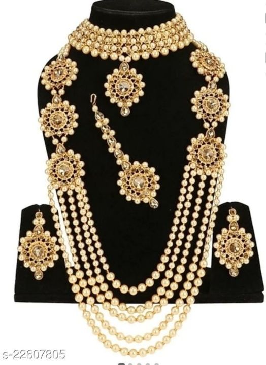 Post image Diva Fancy Jewellery Sets
Base Metal: Alloy
Plating: Gold Plated
Stone Type: Artificial Stones &amp; Beads
Sizing: Adjustable
Type: As Per Image