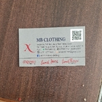 Business logo of M b clothing