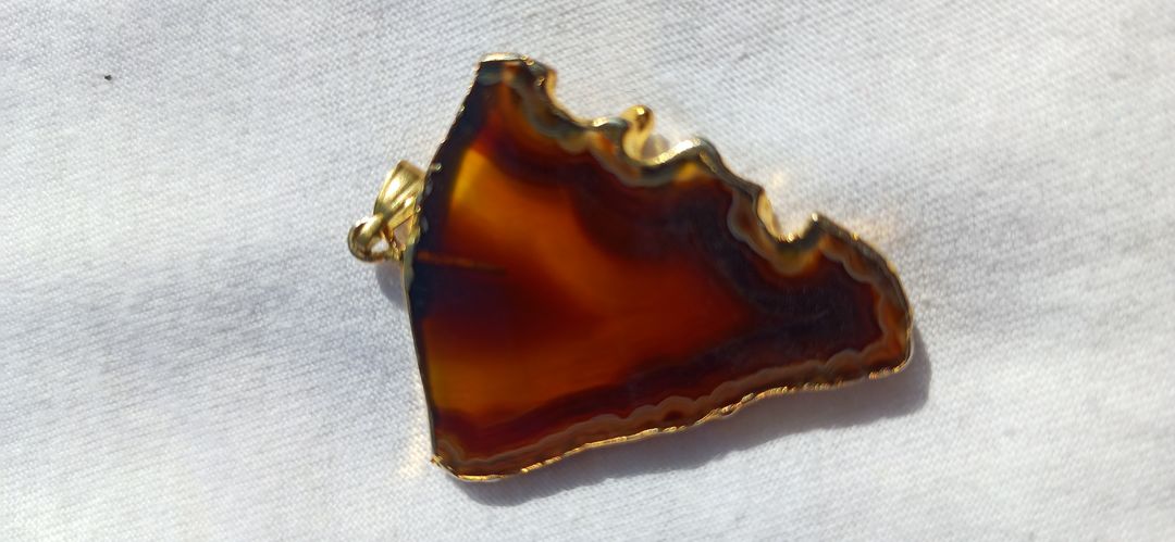 Natural onyx with gold plated pendent. uploaded by business on 11/24/2021
