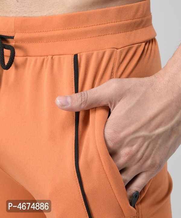 *Orange Cotton Spandex Solid Regular Fit Track Pants*

  uploaded by Shop Online Buy now Low prices🛍️💸 on 12/6/2021
