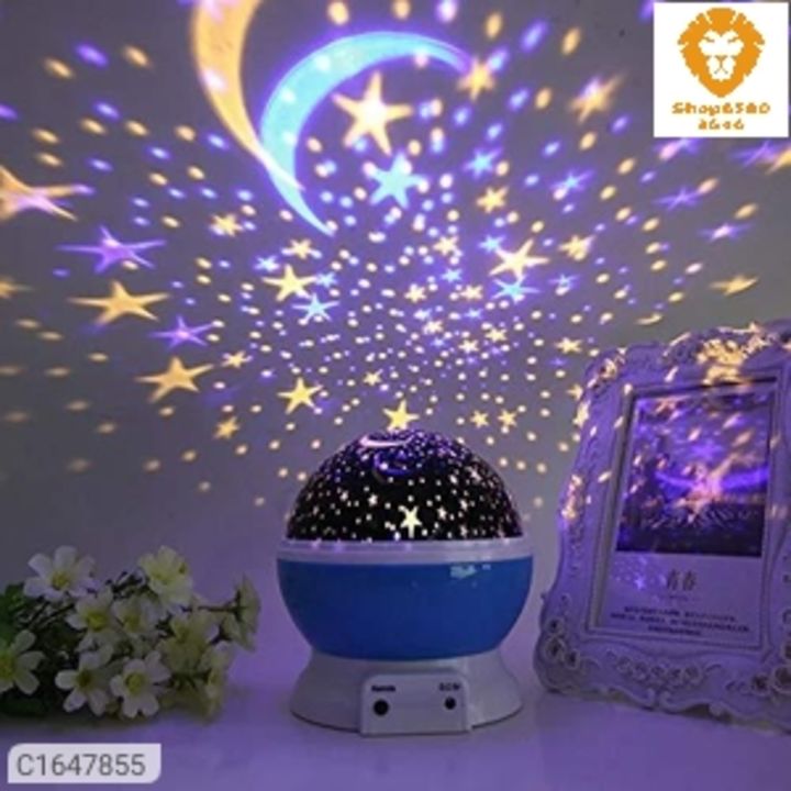Post image *Catalog Name:* Colour Changing Good Night Star Master Rotating Projection Night Lamp⚡⚡ Quantity: Only 5 units available⚡⚡*Details:*Description:- It Has 1 Piece of Colour Changing Good Night Star Master Rotating Projection Night LampMaterial:- PlasticProduct Dimensions (L X B X H in cm) :- 14.5 x 13 x 13 CMProduct Weight: 300 gm Package Dimensions (L X B X H in cm): - 20 X 20 X 5 cmFeature: Sky night light projector fills your room with stars and moonlight so that you feel as if you were laying under the stars, stars, stars, this star projector lamp is a great night light for your kids scared of the dark at bedtime, there are 4 pcs led beads of blue light, warm light, green light, red light, the light is cosy, not dazzling, the baby room décor light does not only give your child universal astronomical science and enhance the capacity of good assistants hands but also give your couple to create a romantic surprise, The product has three buttons, of which the button a is mode button of the night light with warm yellow light formed by covering the lidRomantic cosmos star night light adopts 4 led starry bulbs with the realization of 360-degree panoramic projection so that you and your children feel like being placed in the beautiful galaxy.so you will see vivid red, green, and white stars swirling and twinkling around the room
Product Features :
Distance Is No Longer A Problem :Don't have to get out of bed or sofa to start or close the light anymore. You can turn ON/OFF the baby projector, adjust colourful lights, songs, timer and rotation easily via the remote control.
Auto-Off Timer Design :The baby light projector allows you to set time from 5 - 500 minutes, the whole functions will turn off automatically while the time is ending, effectively realize energy saving.
Starry Sky Projection :Creates a vivid &amp; colourful sky and jungle animal on the wall and ceiling with these two projection films. Enhance your baby's perception of height, depth, and three-di