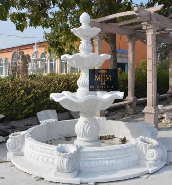 White marble (stone) fountain uploaded by business on 12/13/2021