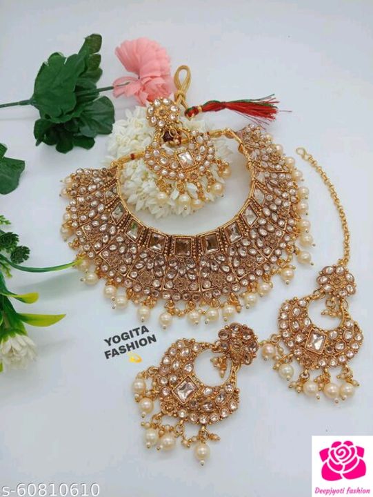 Post image PRICE. 529 free ShippingTwinkling Graceful Women Jewellery SetBase Metal: AlloyPlating: Gold PlatedStone Type: Artificial Stones &amp; BeadsSizing: AdjustableMultipack: 1Sizes:Base Metal: Alloy Plating: Gold Plated - Matte Stone Type: Artificial Stones &amp; Beads Sizing: Choker Multipack: 1 Sizes: Base Metal: Alloy Plating: Gold Plated Stone Type: Artificial Stones &amp; Beads Sizing: Adjustable Type: Necklace Add On: Earring with Maangtika Multipack: 1 Sizes: Free Size Country of Origin: IndiaShare Text: Catalog Name:Twinkling Fancy Women Jewellery Set Base Metal: Alloy Plating: Gold Plated - Matte Stone Type: Artificial Stones &amp; Beads Sizing: Choker Multipack: 1 Sizes:Free Size Easy Returns Available In Case Of Any IssueCountry of Origin: India