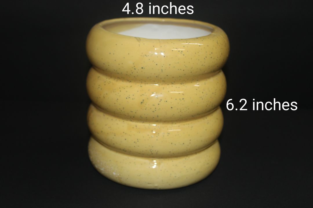 Yellow ceramic heavy planter uploaded by Pawrise Solutions Private Limited on 1/9/2022