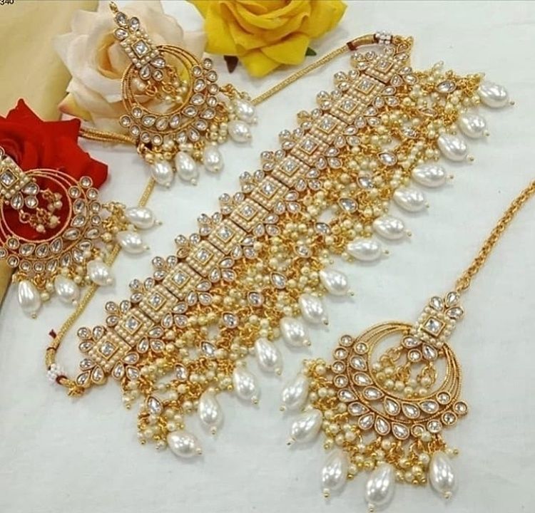 Post image Kundan pearl style choker set with earrings and maangteek
Premium quality