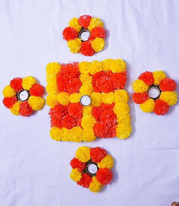 Floral rangoli with tea lights uploaded by business on 10/3/2020