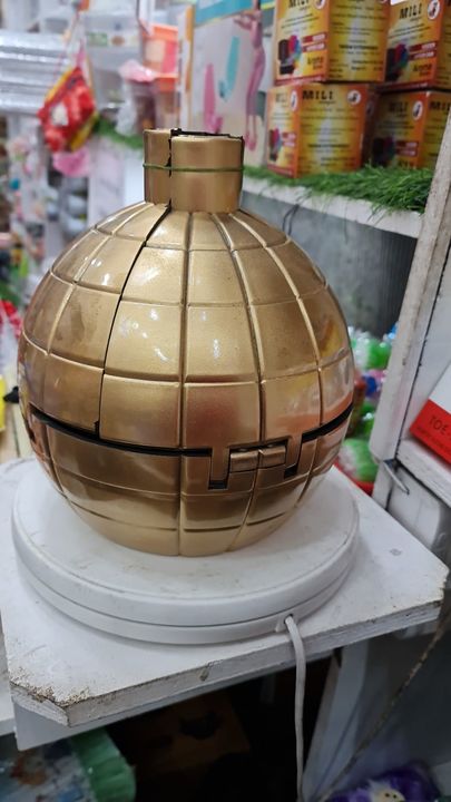 Golden bomb shaped cake  uploaded by business on 1/26/2022