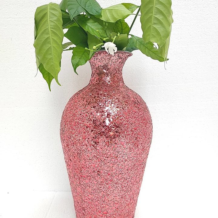 Metal flower vase with glass mosaic work.  uploaded by business on 10/10/2020