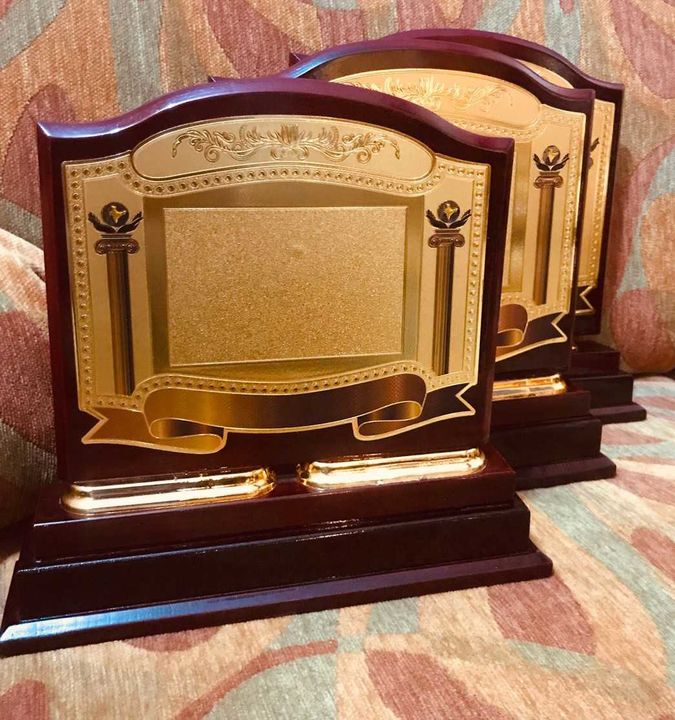 Wooden memntoo trophy award uploaded by business on 3/4/2022