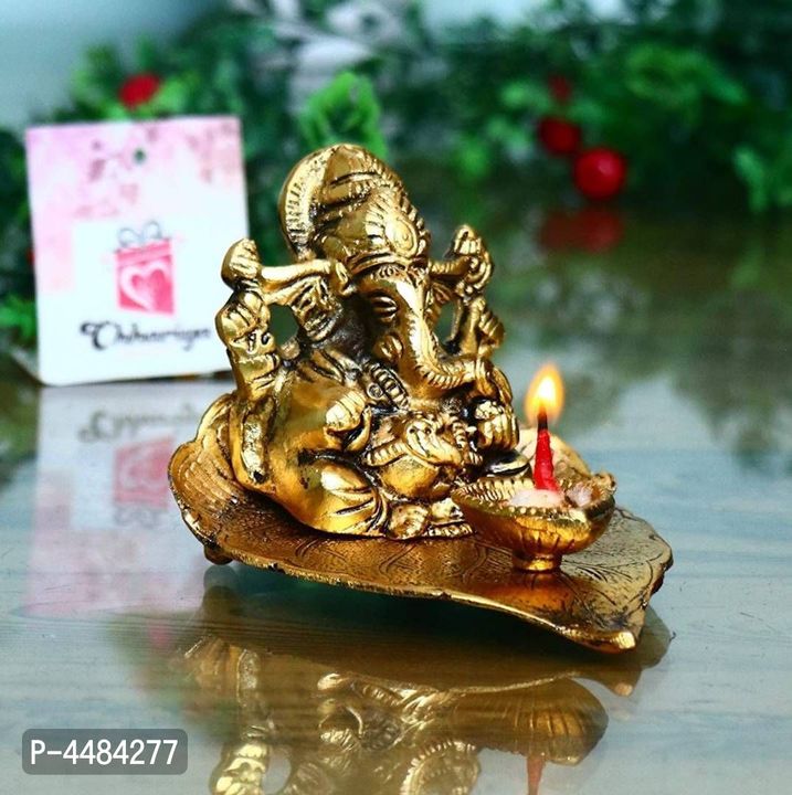 #Metal Ganesh On Leaf with Diya Idol Showpiece for Home Décor  uploaded by Fashionable Selling products on 3/13/2022