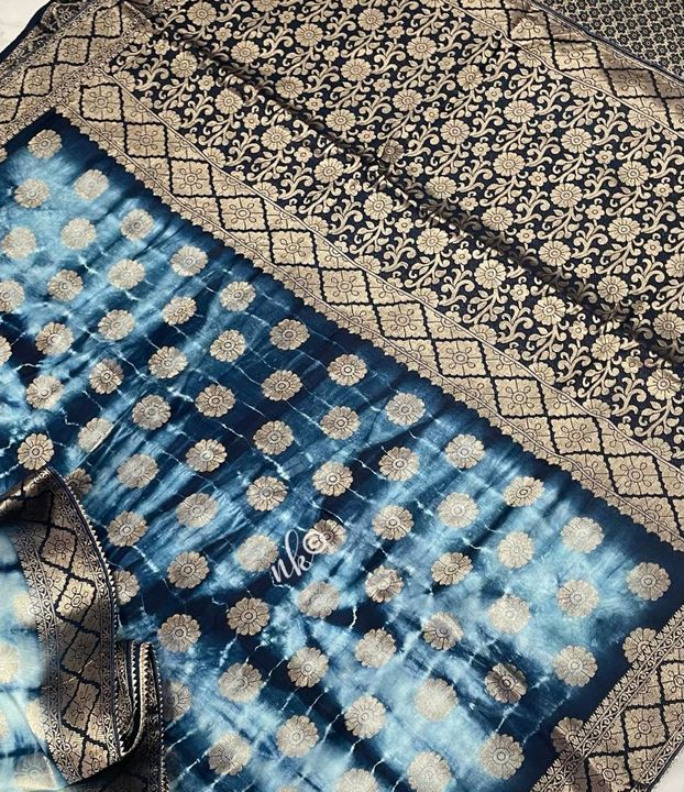 Post image *Pure Tussar by dola crepe silk with beautiful zari buties and zari border highlighted with gotapatti lace in lovely shibori dye paired with contrast brocade blouse*
*Reseller price 3900
*Multiples*
