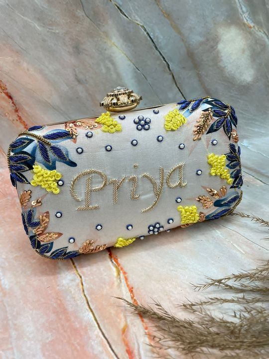 Post image ✨✨ *New Design*✨✨*Designer Printed Embroidery Name Customization Clutch*❤️ *Price: Rs 1200 Free Shipping*❤️ *Size: 8by4*❤️ *Designer Lock*❤️ *Fabric: Printed Satin*❤️ *Sling chain included*