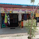 Business logo of Dhaneshwari cloth merchant