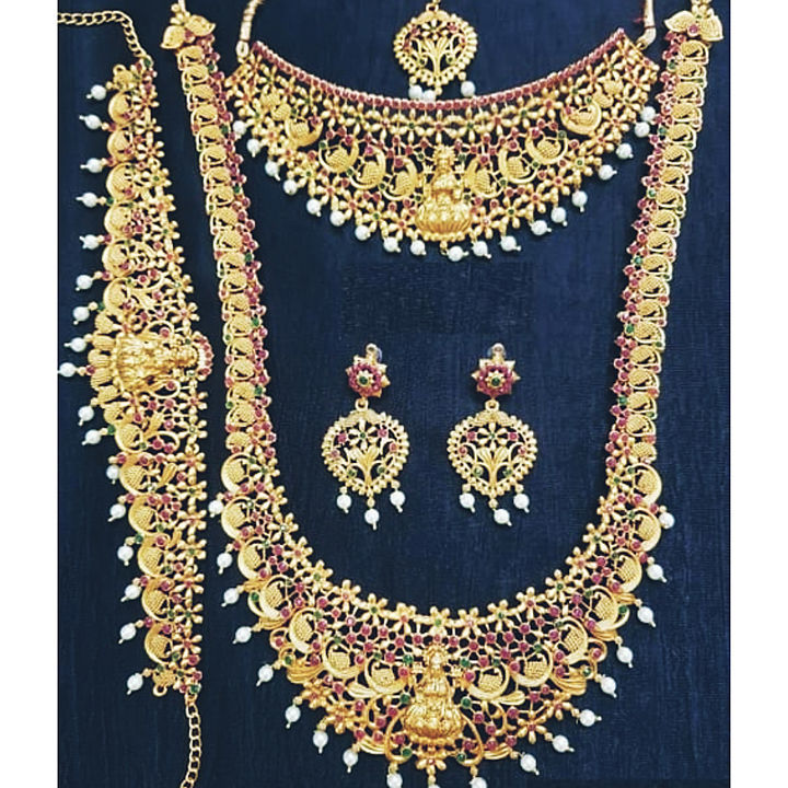 Post image *Catalog Name:* Antique Stones And Pearls Temple Bridal Jewellery Necklace sets.
*Details:*
Description : It has 2 Pieces Of Necklace, 1 Pair Of Earring, 1 Mang Tika &amp; 1 Kamarbandh
Material: Alloy
Size : Adjustable
Work : Gold Plated, Stones, Pearls
Designs: 4
Free shipping available 💥
Payment method:COD/Google pay/paytm/phone pe.
Price: 1999 only festival season offer price 💥