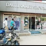 Business logo of Dauji Saree Showroom & Readymade Garments