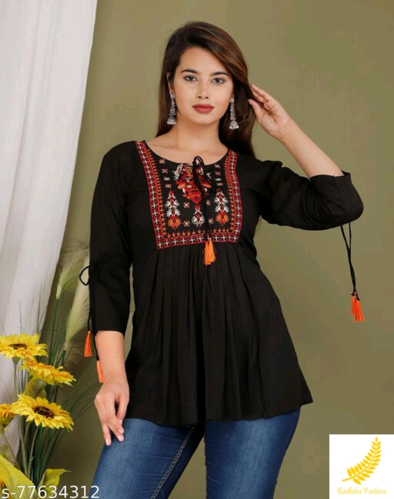 Post image TOPName: TOPFabric: RayonSleeve Length: Three-Quarter SleevesPattern: EmbroideredNet Quantity (N): 1Sizes:M (Bust Size: 38 in, Length Size: 28 in) L (Bust Size: 40 in, Length Size: 28 in) XL (Bust Size: 42 in, Length Size: 28 in) XXL (Bust Size: 44 in, Length Size: 28 in) 
BEAUTIFUL RAYON EMBROIDERED TOP , TASSELS ON NECK AND TIE UP SLEEVESS Country of Origin: India