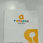 Business logo of Popcorn kids store.