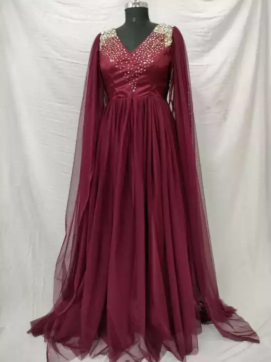Post image This gown is made in soft lace net and satin . It has pearl and bead work on shoulder and neck. It comes in marron and wine shade.